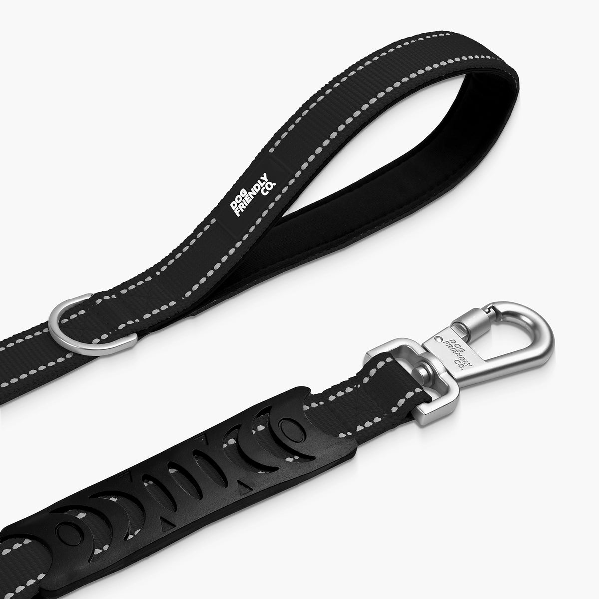 Close-up of the black bungee dog leash showing the padded handle, metal D-ring, adjustable bungee section and heavy-duty clip.