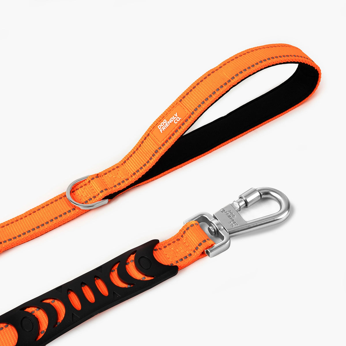 Close-up of the hi-vis orange bungee leash showing the padded handle, reflective stitching and metal clip.