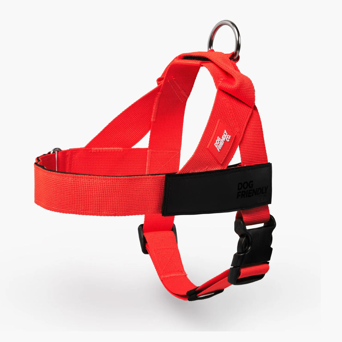 Red Dog Friendly Co. no-pull harness with a black name patch, laid flat on a white background