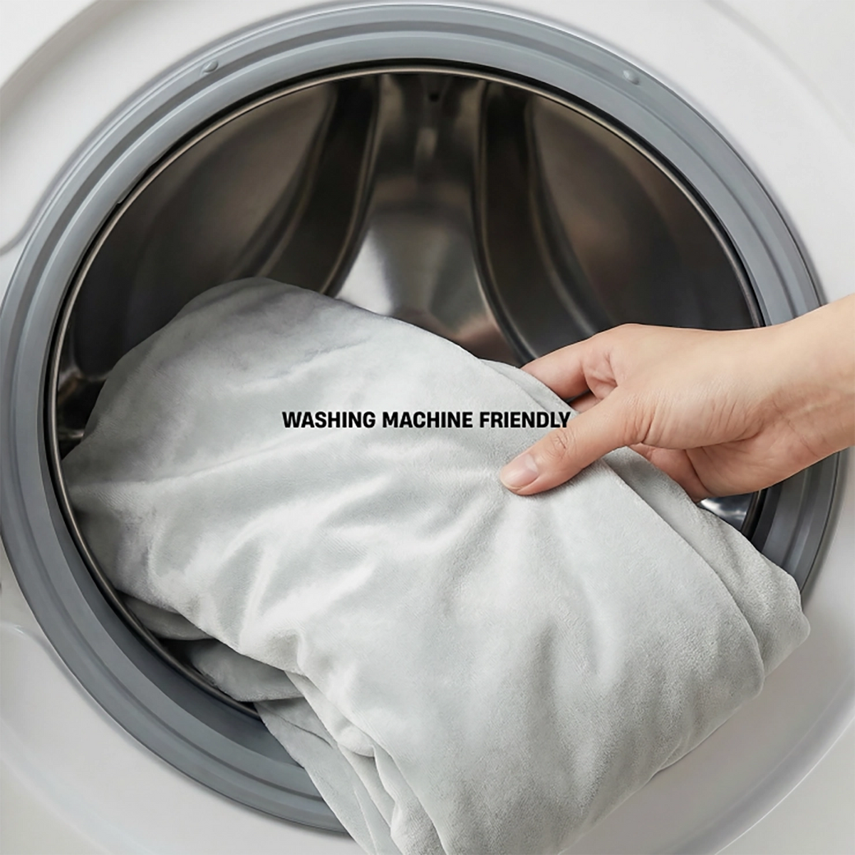 Grey replacement cover being placed into a washing machine with text reading “Washing Machine Friendly”.